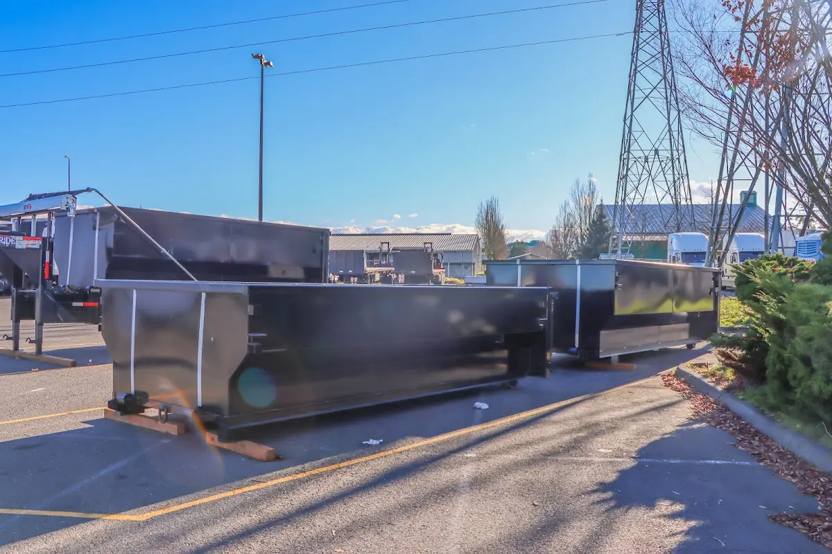 Roll-off dumpster ready for waste disposal at job site for 12 Yard Dumpster Rental in College Station